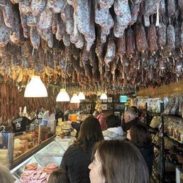 This sausages drying from the ceiling while they are part of this unique decor!