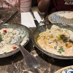 Baba ghanouj with pomegranate and spicy hummus