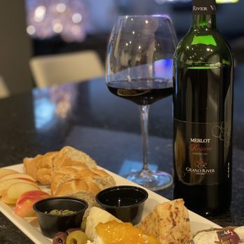 Grand River Cellars - a glass of red wine and a plate of cheese and fruit - Wineries Near Me - Madison, Ohio
