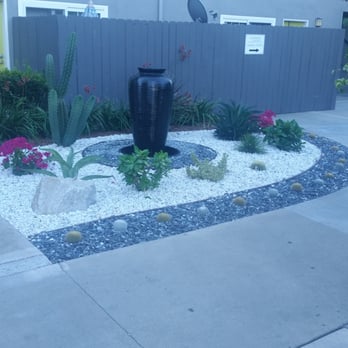 A Plus Landscape Service - a black vase in a garden - Tree Services Near Me A Plus Landscape Service - a black vase in a garden - Tree Services Near Me