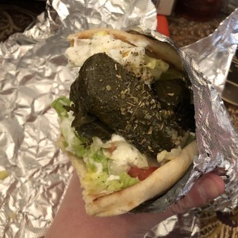 Taste of Greece - Veggie pita with grape leaves, feta, tzatziki, lettuce, tomatoes and Greek salad peppers! - Greek Near Me - Columbus, Ohio Taste of Greece - Veggie pita with grape leaves, feta, tzatziki, lettuce, tomatoes and Greek salad peppers! - Greek Near Me - Columbus, Ohio