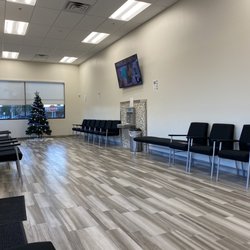Nevada Comprehensive Pain Center - Waiting area with a water foundation and a TV