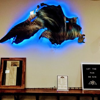 Copper Crow Distillery - Neat rustic chic artwork, including tables made from the wood of an old bowling alley. - Distilleries Near Me - Bayfield, Wisconsin
