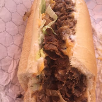 Sub Center - Philly Cheesesteak with lettuce, grilled onions and American cheese!  Get the footlong otherwise you'll regret it (like me)! - Sandwiches Near Me - Hollywood, Florida