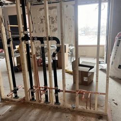 Bentek Plumbing & Mechanical - Commercial rough-in with cast iron waste and vent piping and copper domestic water piping.