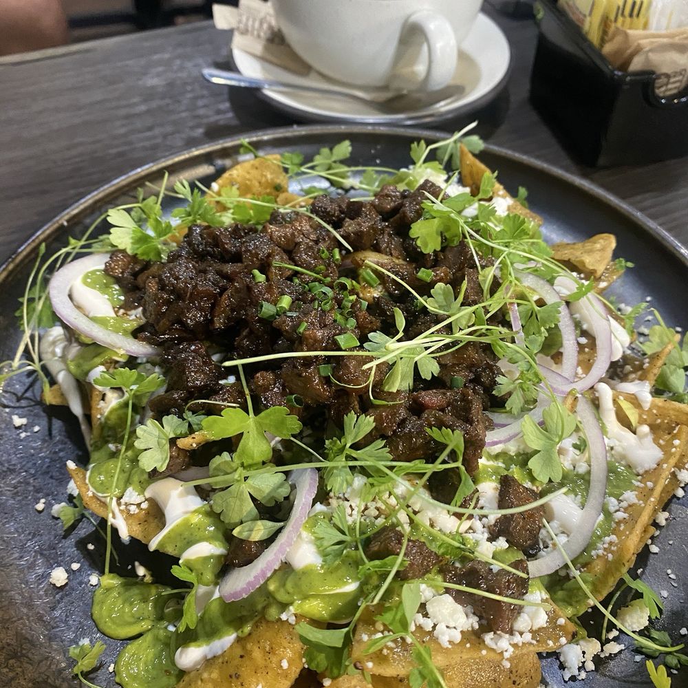 Brunch by De Martino - Chilaquiles de Salsa Verde with carne asada - Latin American Near Me - Somerville, New Jersey
