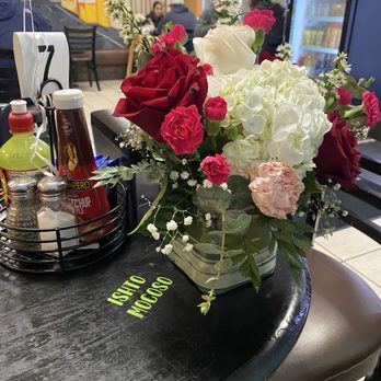 Antojitos Guatemaltecos - Flowers on the tables - Latin American Near Me - El Cerrito, California Antojitos Guatemaltecos - Flowers on the tables - Latin American Near Me - El Cerrito, California
