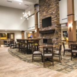 Large open foyer/lobby and cafe are behind it with see through gas fireplace Large open foyer/lobby and cafe are behind it with see through gas fireplace