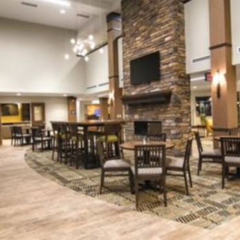 Staybridge Suites Marquette - Large open foyer/lobby and cafe are behind it with see through gas fireplace - Hotels Near Me - Marquette, Michigan Staybridge Suites Marquette - Large open foyer/lobby and cafe are behind it with see through gas fireplace - Hotels Near Me - Marquette, Michigan