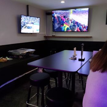ShanSki’s Valley Pub - a woman sitting at a table in front of a tv - Sports Bars Near Me - Methuen, Massachusetts ShanSki’s Valley Pub - a woman sitting at a table in front of a tv - Sports Bars Near Me - Methuen, Massachusetts