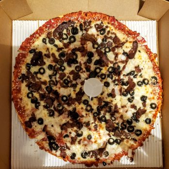 Jet's Pizza - Large Pizza with Steak, Olives and Onions on a Thin Sesame Seed Crust from Jet's Adrian - Pizza Near Me - Adrian, Michigan