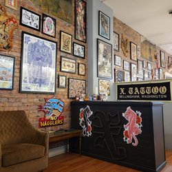 X. Tattoo - Entry and check-in desk.