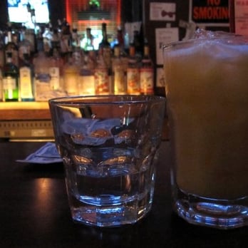 12th Street Ale House - Shot of gin and glass of orange juice - Pubs Near Me - New York, New York 12th Street Ale House - Shot of gin and glass of orange juice - Pubs Near Me - New York, New York