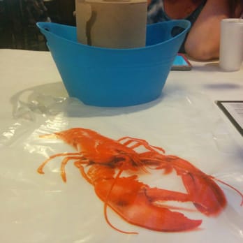 Crawfish House - Paper towel roll, bib and shell bucket - Cajun/Creole Near Me - Seattle, Washington Crawfish House - Paper towel roll, bib and shell bucket - Cajun/Creole Near Me - Seattle, Washington