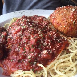 Oscar's Harborside Cucina - Spaghetti with meatballs. Giant meatball to the right. The sausage was added complimentary.