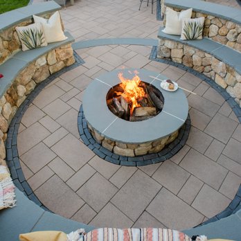 Madrona Brothers - a circular fire pit with seating around it - Lawn Services Near Me - Framingham, Massachusetts Madrona Brothers - a circular fire pit with seating around it - Lawn Services Near Me - Framingham, Massachusetts