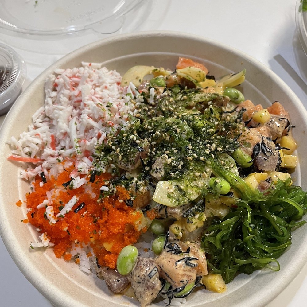 a bowl of rice, carrots, broccoli, and other vegetables a bowl of rice, carrots, broccoli, and other vegetables