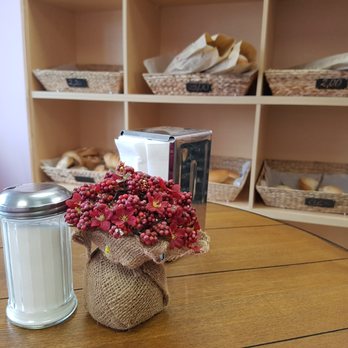 Dulce Aroma - a vase of flowers on a table - Bakeries Near Me - Toronto, Ontario Dulce Aroma - a vase of flowers on a table - Bakeries Near Me - Toronto, Ontario