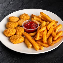 Fuego Cravings - Kids meal: Six crispy chicken nuggets served with seasoned fries and a medium drink.