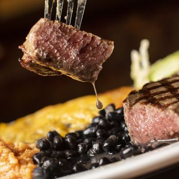 El Patron ABQ - a piece of steak being lifted by a fork - New Mexican Cuisine Near Me - Albuquerque, New Mexico El Patron ABQ - a piece of steak being lifted by a fork - New Mexican Cuisine Near Me - Albuquerque, New Mexico