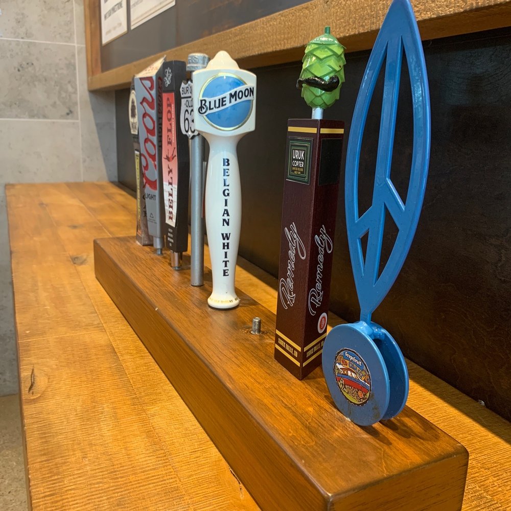 SPIN! Pizza - a row of beer taps - Pizza Near Me - Papillion, Nebraska SPIN! Pizza - a row of beer taps - Pizza Near Me - Papillion, Nebraska