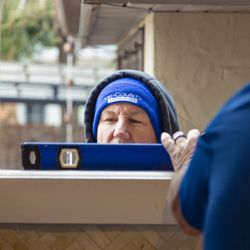 Tri-County Enterprises - Bill from Tri-County measures carefully for a window installation done right.