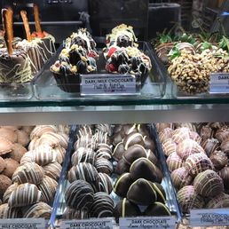 a display of chocolate covered donuts
