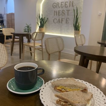Green Nest Cafe - Large coffee and spicy egg and hummus on sourdough. - Cafes Near Me - Bedford, Texas