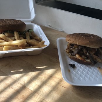 CaliMex Food - a sandwich and fries on a table - New American Near Me - San Diego, California CaliMex Food - a sandwich and fries on a table - New American Near Me - San Diego, California