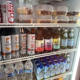 Refrigerator with waters, kombuchas, sodas. Refrigerator with waters, kombuchas, sodas.