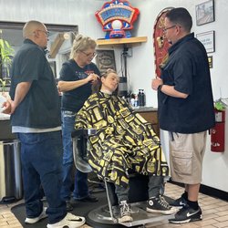 Tina's Barber & Styling - Making sure his lines were straight and Tina taking a moment to teach!!