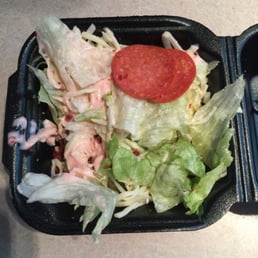Dried out wilted side salad that they sold to us!!! It went in the trash....Pitiful!!