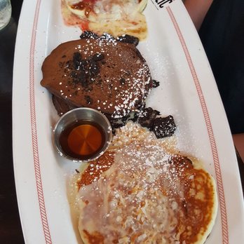 Breakfast Republic - Pancake flight. From the bottom lemon coconut, oreo, and strawberry cheesecake. - Breakfast & Brunch Near Me - San Diego, California Breakfast Republic - Pancake flight. From the bottom lemon coconut, oreo, and strawberry cheesecake. - Breakfast & Brunch Near Me - San Diego, California