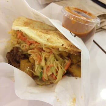Guasaca - Shredded beef arepa with slaw, onions, and plantains. Picture is blurry, but I didn't retake it because I was too excited to eat! - Venezuelan Near Me - Raleigh, North Carolina Guasaca - Shredded beef arepa with slaw, onions, and plantains. Picture is blurry, but I didn't retake it because I was too excited to eat! - Venezuelan Near Me - Raleigh, North Carolina