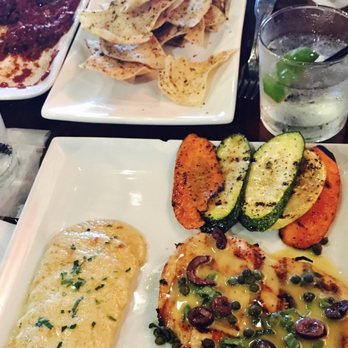 Mezza Grille - Lemon Butter Chicken topped with lemon butter sauce, Kalamata olives & basil - Mediterranean Near Me - Houston, Texas