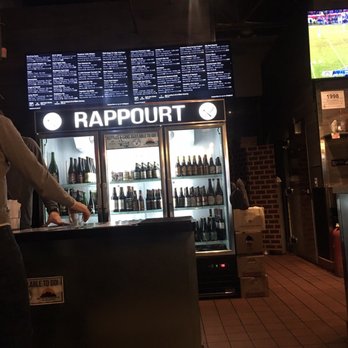 RAPPOURT - Beer menu and fridge at the bar - Bars Near Me - Ann Arbor, Michigan