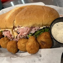 The Merry Table - The Invention - Shaved ham, parmesan, cream cheese, lettuce, red onion, mayonnaise, oil & vinegar (I added tomato). So good!
