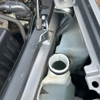 Tom Bell Chevrolet - Windshield washer cap missing, the engine bay all covered in the fluid - Car Dealers Near Me - Redlands, California Tom Bell Chevrolet - Windshield washer cap missing, the engine bay all covered in the fluid - Car Dealers Near Me - Redlands, California