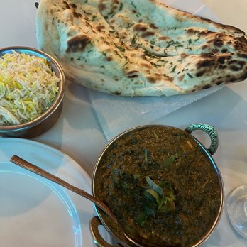 India Bistro - a plate of food and a naan - Indian Near Me - Seattle, Washington India Bistro - a plate of food and a naan - Indian Near Me - Seattle, Washington