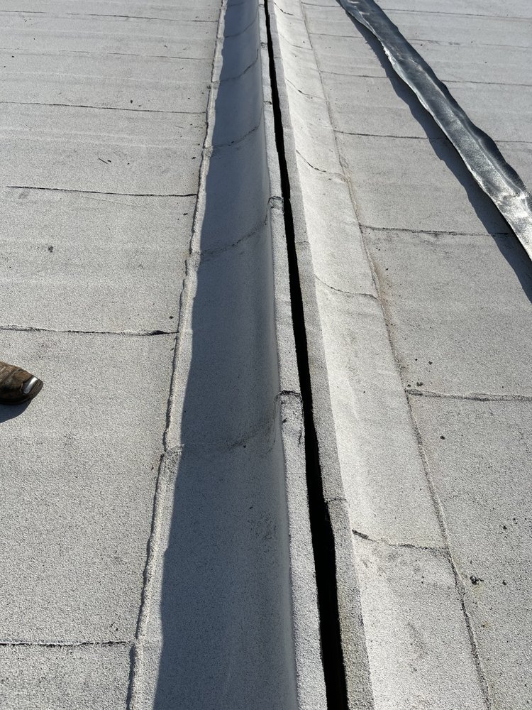 Slide of JM Roofing and Construction