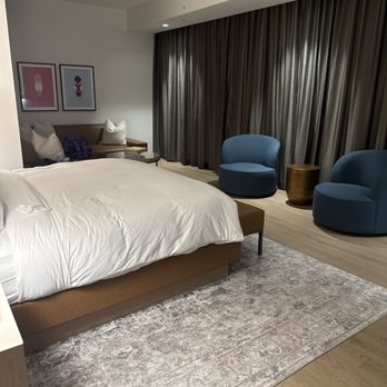 JW Marriott Reston Station - One bedroom suite, bed, and large seating area - Hotels Near Me - Reston, Virginia JW Marriott Reston Station - One bedroom suite, bed, and large seating area - Hotels Near Me - Reston, Virginia