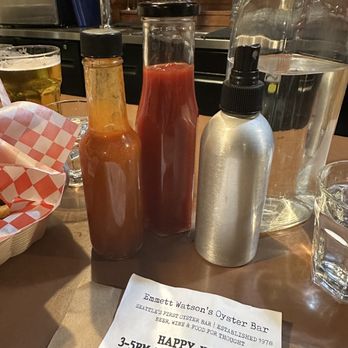 Emmett Watson's Oyster Bar - Tabasco made in house, ketchup, and that spray bottle is malt vinegar (for better distribution over your food) - Seafood Near Me - Seattle, Washington