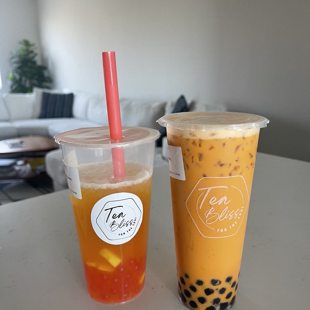 Mango tea with strawberry popping pearls + Thai Tea with regular boba - both 75% sweetness. So good!