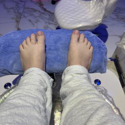 Blue Ocean Nails & Spa - The finished product of a GEL pedicure. Look closely & you can see the paint is uneven,polish on my skin and the nails are not evenly shaped