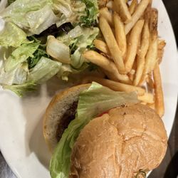 Anthony Jacks Wood Fired Grill - The delicious hamburger on a beautiful roll, with lettuce, tomato, and red onion. This burger was on point with a nice charcoal grill taste.