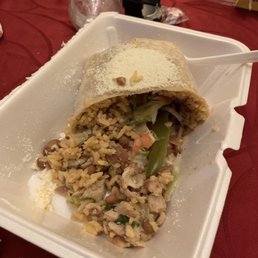 Half of a chicken burrito Half of a chicken burrito