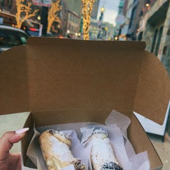 Mike's Pastry - Pecan caramel cannoli on the left and an oreo cannoli on the right - Bakeries Near Me - Boston, Massachusetts