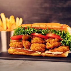 DraftKings At Casino Queen Sportsbook - Shrimp Po'Boy: fried shrimp, remoulade, lettuce, tomato, pickle, French roll