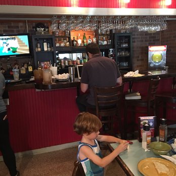 Mi Madre's Restaurant - Employee doing taxes or?? Papers all over bar - Tex-Mex Near Me - Austin, Texas