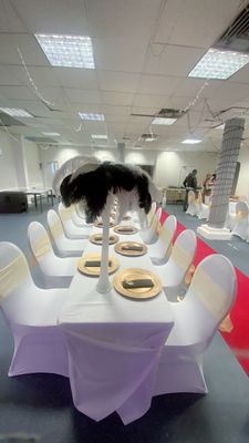 Flavourz Event and Party Services - White glass centrepiece with black and white ostrich  feathers available for hire . - London, XGL
